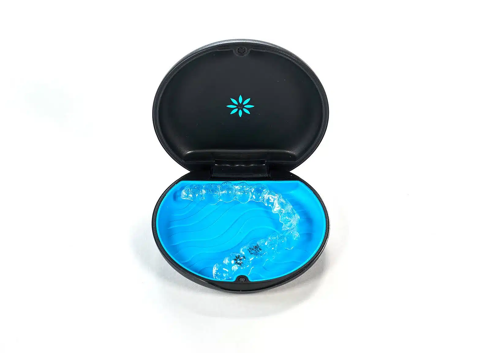 Clear Invisalign aligners stored in a protective case, highlighting foods to avoid with Invisalign to prevent damage